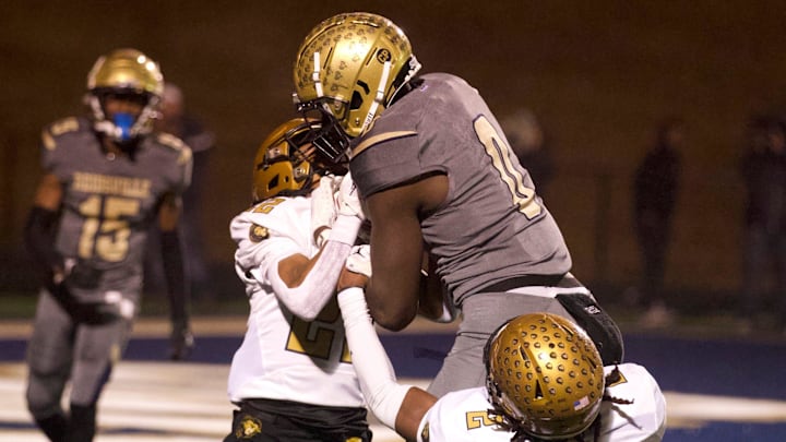 Reidsville football's Kendre Harrison outmuscles a pair of Shelby tacklers on his way to the end zone as a freshman. He's even bigger and more powerful now.