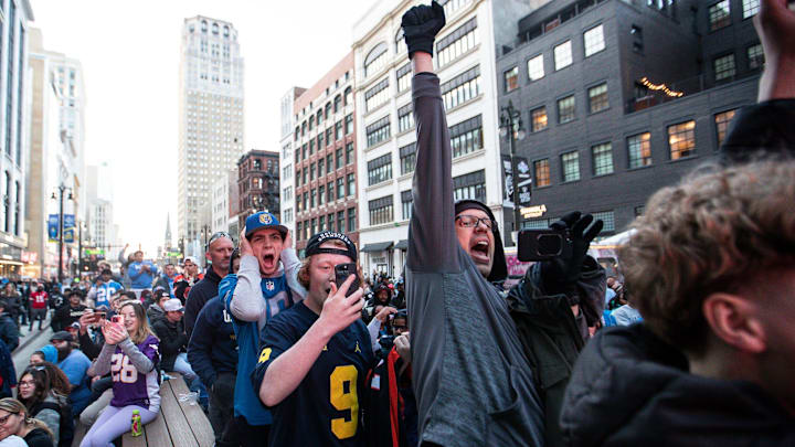 Chicago Bears fan DJ Reed, pumps his fist to celebrate the announcement of Caleb Williams as No. 1 overall pick.