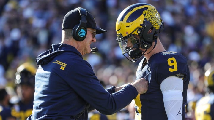 Michigan coach Jim Harbaugh talks to quarterback J.J. McCarthy before the start of the Rose Bowl vs. Alabama in Pasadena, California, on Monday, Jan. 1, 2024.