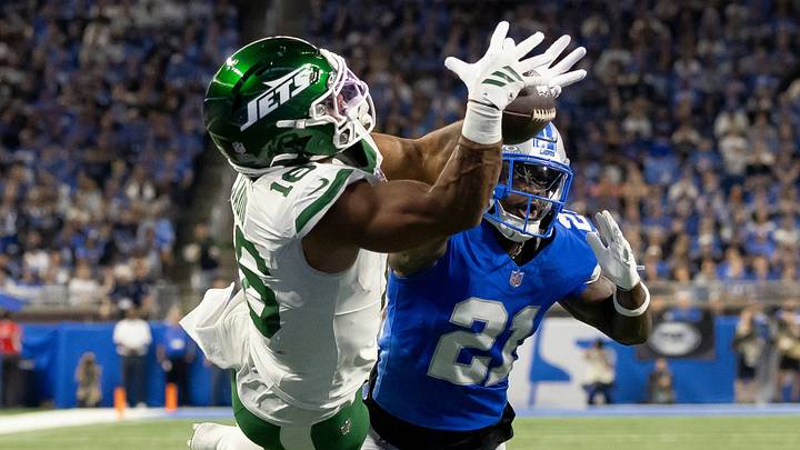 Sep 27, 2026; Detroit, Michigan, USA;  New York Jets tight end Kenyon Sadiq (16) catches a touchdown pass over Detroit Lions cornerback Roger McCreary (21) at Ford Field.  Mandatory Credit: David Reginek-Imagn Images