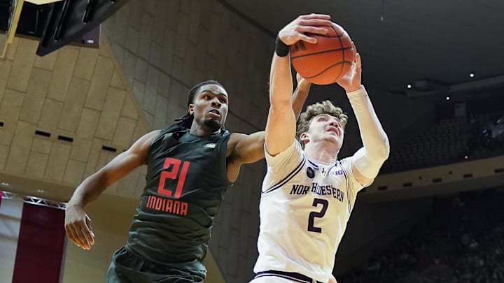 Northwestern's Nick Martinelli (2) rebounds the ball against Indiana's Mackenzie Mgbako (21) at Simon Skjodt Assembly Hall. 