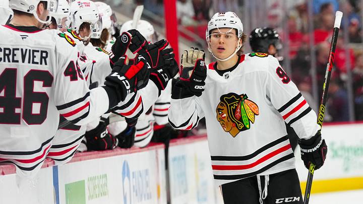 Jan 30, 2025; Raleigh, North Carolina, USA; Chicago Blackhawks center Connor Bedard (98) celebrates his goal against the Carolina Hurricanes during the third period at Lenovo Center. Mandatory Credit: James Guillory-Imagn Images
