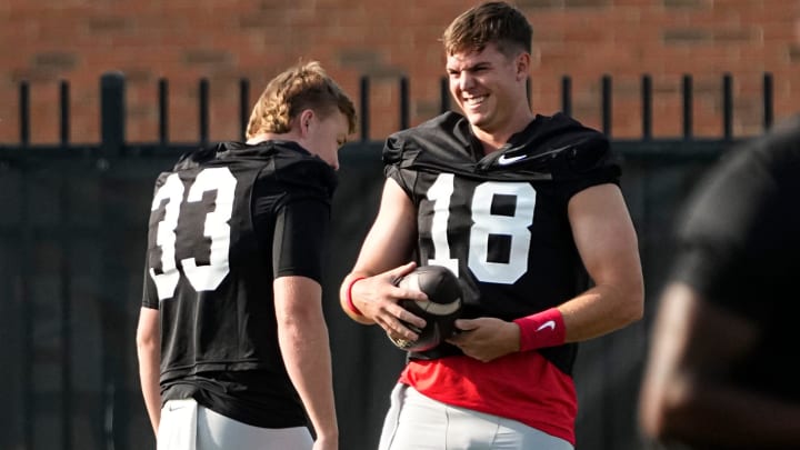 Aug 1, 2024; Columbus, OH, USA; Ohio State Buckeyes quarterback Will Howard (18) laughs with quarterback Devin Brown (33) during football camp at the Woody Hayes Athletic Complex. Aug 1, 2024; Columbus, OH, USA; Ohio State Buckeyes quarterback Will Howard (18) laughs with quarterback Devin Brown (33) during football camp at the Woody Hayes Athletic Complex.