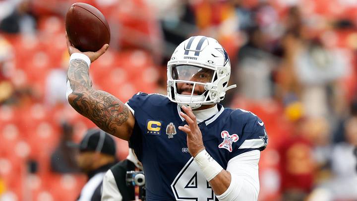 Dallas Cowboys quarterback Dak Prescott warms up before the game against the Washington Commanders.