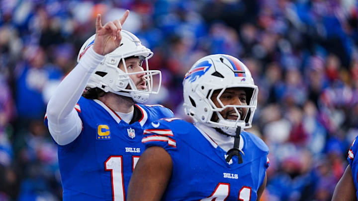 Buffalo Bills quarterback Josh Allen signals they are going for the two-point conversion during the second half of the Buffalo Bills wild card game against the Denver Broncos at Highmark Stadium in Orchard Park on Jan. 12, 2025. Smiling about the touchdown is Buffalo Bills fullback Reggie Gilliam. Buffalo Bills quarterback Josh Allen signals they are going for the two-point conversion during the second half of the Buffalo Bills wild card game against the Denver Broncos at Highmark Stadium in Orchard Park on Jan. 12, 2025. Smiling about the touchdown is Buffalo Bills fullback Reggie Gilliam.