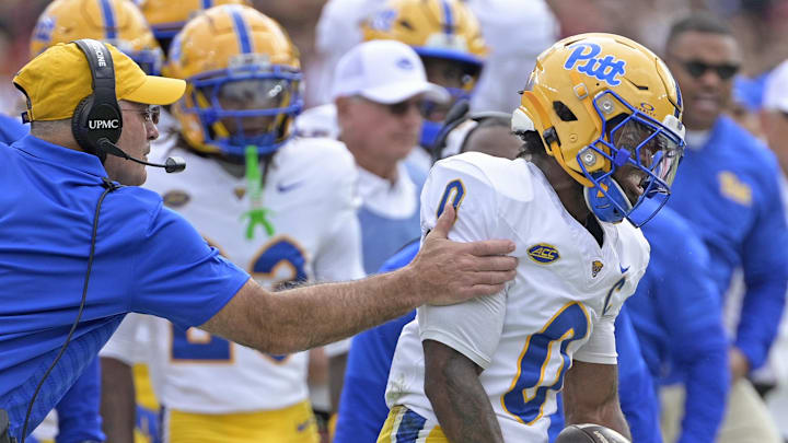 Oct 11, 2025; Tallahassee, Florida, USA; Pittsburgh Panthers running back Desmond Reid (0) is held back as he reacts to a big play in the first quarter against the Florida State Seminoles at Doak S. Campbell Stadium. Mandatory Credit: Melina Myers-Imagn Images Oct 11, 2025; Tallahassee, Florida, USA; Pittsburgh Panthers running back Desmond Reid (0) is held back as he reacts to a big play in the first quarter against the Florida State Seminoles at Doak S. Campbell Stadium. Mandatory Credit: Melina Myers-Imagn Images