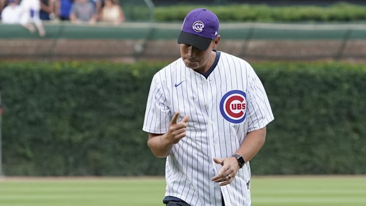 Jul 7, 2024; Chicago, Illinois, USA; Northwestern basketball coach Chris Collins gestures after throwing out the first pitch before the game between the Chicago Cubs and the Los Angeles Angels at Wrigley Field. Mandatory Credit: David Banks-Imagn Images