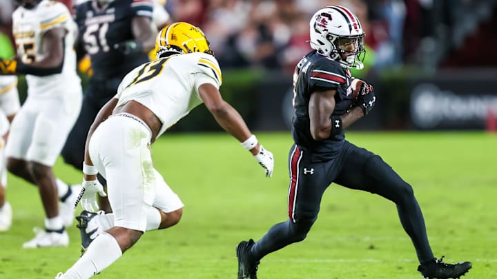 Nov 16, 2024; Columbia, South Carolina, USA; South Carolina Gamecocks wide receiver Mazeo Bennett Jr. (3) runs after a reception as Missouri Tigers safety Daylan Carnell (13) closes in during the second quarter at Williams-Brice Stadium. Mandatory Credit: Jeff Blake-Imagn Images