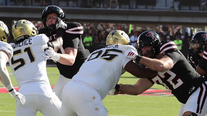 Nov 15, 2025; Lubbock, Texas, USA; Texas Tech Red Raiders offensive lineman Sheridan Wilson (72) and offensive lineman Jacob Ponton (70) blocks Central Florida Knights defensive end Malachi Lawrence (51) and defensive tackle RJ Jackson Jr. (95) in the first half at Jones AT&T Stadium. Mandatory Credit: Michael C. Johnson-Imagn Images Nov 15, 2025; Lubbock, Texas, USA; Texas Tech Red Raiders offensive lineman Sheridan Wilson (72) and offensive lineman Jacob Ponton (70) blocks Central Florida Knights defensive end Malachi Lawrence (51) and defensive tackle RJ Jackson Jr. (95) in the first half at Jones AT&T Stadium. Mandatory Credit: Michael C. Johnson-Imagn Images