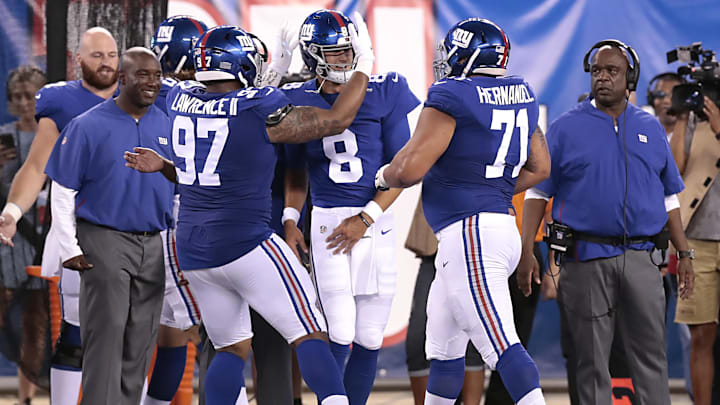Dexter Lawrence, Will Hernandez, and Daniel Jones celebrate following a touchdown pass in 2019.