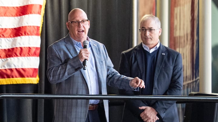 Apr 15, 2025; Saint Paul, Minnesota, USA; Prior to the game between the Minnesota Wild and Anaheim Ducks, Bob Motzko is announced as the head coach for the 2026 IIHF World Junior Hockey Championship by John Vanbiesbrouck (right). The ceremony was held at Xcel Energy Center. Mandatory Credit: Matt Blewett-Imagn Images