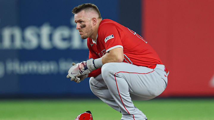 Jun 18, 2025; Bronx, New York, USA; Los Angeles Angels designated hitter Mike Trout (27) looks on from second base during a stoppage in play during the eighth inning against the New York Yankees at Yankee Stadium. Mandatory Credit: Vincent Carchietta-Imagn Images