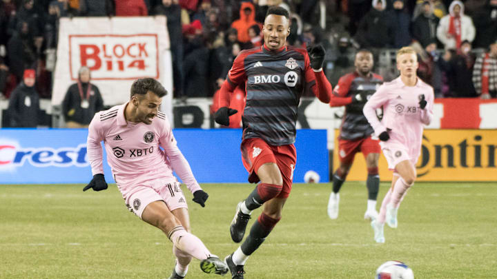 Corentin Jean #14 (L) and Mark-Anthony Kaye #14 (R) in... Corentin Jean #14 (L) and Mark-Anthony Kaye #14 (R) in...