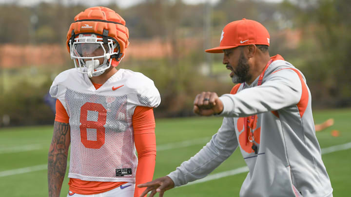 Clemson cornerbacks coach Mike Reed instructs Avieon Terrell (8) during Spring Practice in Clemson, S.C. Monday, March 24, 2025.