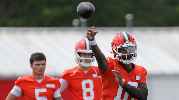 Browns quarterback Shedeur Sanders throws as QBs Dillon Gabriel (5) and Kenny Pickett look on during minicamp, Tuesday, June 10, 2025, in Berea.