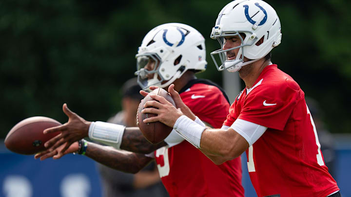 Indianapolis Colts quarterbacks Anthony Richardson Sr. (5) and Daniel Jones (17) pass Friday, July 25, 2025, during training camp held at Grand Park in Westfield. Indianapolis Colts quarterbacks Anthony Richardson Sr. (5) and Daniel Jones (17) pass Friday, July 25, 2025, during training camp held at Grand Park in Westfield.