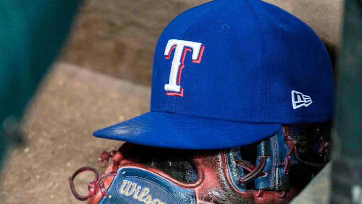 Jun 20, 2017; Arlington, TX, USA; A view of a Texas Rangers baseball hat and Wilson glove during the game between the Texas Rangers and the Toronto Blue Jays at Globe Life Park in Arlington. 