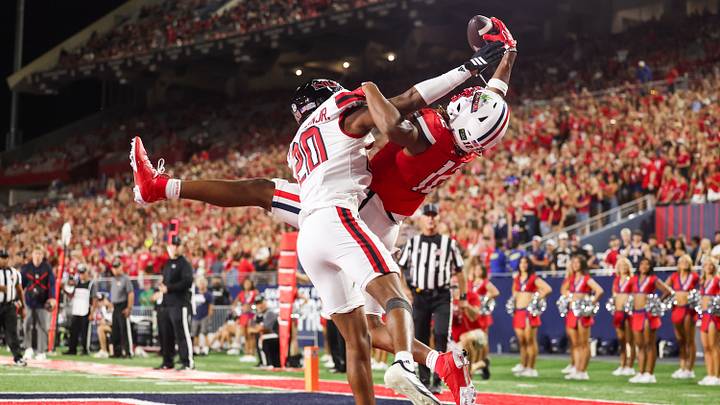 Sep 19, 2026; Tucson, Arizona, USA; Arizona Wildcats wide receiver Tre Spivey (12) catches a one-handed touchdown pass during the second quarter of the game against the Northern Illinois Huskies at Casino Del Sol Stadium. Sep 19, 2026; Tucson, Arizona, USA; Arizona Wildcats wide receiver Tre Spivey (12) catches a one-handed touchdown pass during the second quarter of the game against the Northern Illinois Huskies at Casino Del Sol Stadium.