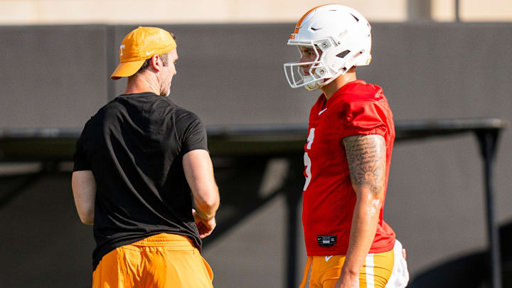 Tennessee quarterback Joey Aguilar (6) with offensive coordinator and quarterbacks coach Joey Halzle, left, during Vols' football's first day of fall camp in Knoxville on July 30, 2025. Tennessee quarterback Joey Aguilar (6) with offensive coordinator and quarterbacks coach Joey Halzle, left, during Vols' football's first day of fall camp in Knoxville on July 30, 2025.