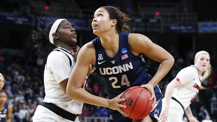 Mar 31, 2019; Albany , NY, USA; UConn Huskies forward Napheesa Collier (24) drives to the basket against Louisville Cardinals forward Bionca Dunham (left) during the second half in the championship game of the Albany regional in the women's 2019 NCAA Tournament at Times Union Center. Mandatory Credit: Rich Barnes-Imagn Images