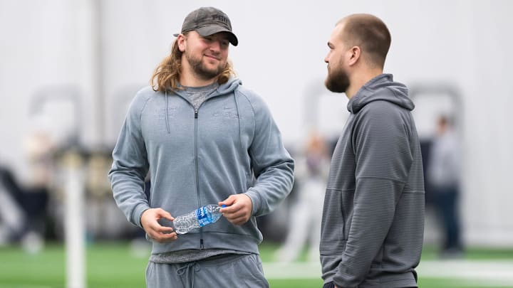 Tight end Tyler Warren, left, talks with letterman Pat Freiermuth during Penn State's Pro Day in Holuba Hall on March 28, 2025, in State College.