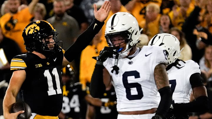 Iowa Hawkeyes quarterback Mark Gronowski signals first down n front of Penn State Nittany Lions safety Zakee Wheatley. Iowa Hawkeyes quarterback Mark Gronowski signals first down n front of Penn State Nittany Lions safety Zakee Wheatley.