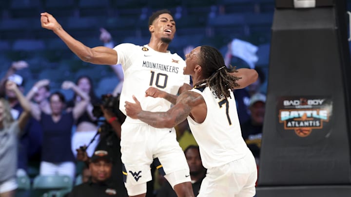 Nov 27, 2024; Paradise Island, Bahamas, BHS; West Virginia Mountaineers guard Sencire Harris (10) celebrates with West Virginia Mountaineers guard Javon Small (7) during overtime against the Gonzaga Bulldogs at the Atlantis Resort.  Mandatory Credit: Kevin Jairaj-Imagn Images