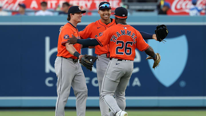 Jul 5, 2025; Los Angeles, California, USA; (From left to right) Houston Astros center fielder Jake Meyers (6) and right fielder Cam Smith (11) and left fielder Taylor Trammell (26) celebrate a win after defeating the Los Angeles Dodgers 6-4 at Dodger Stadium. Jul 5, 2025; Los Angeles, California, USA; (From left to right) Houston Astros center fielder Jake Meyers (6) and right fielder Cam Smith (11) and left fielder Taylor Trammell (26) celebrate a win after defeating the Los Angeles Dodgers 6-4 at Dodger Stadium.