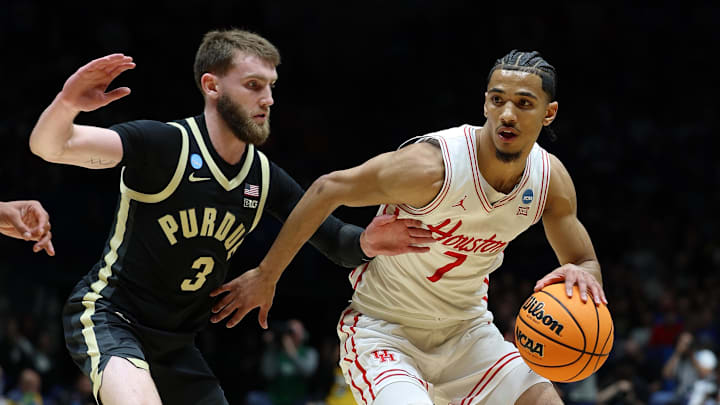 Mar 28, 2025; Indianapolis, IN, USA; Houston Cougars guard Milos Uzan (7) dribbles the ball against Purdue Boilermakers guard Braden Smith (3) in the first half during a Midwest Regional semifinal of the 2025 NCAA tournament at Lucas Oil Stadium. Mandatory Credit: Trevor Ruszkowski-Imagn Images