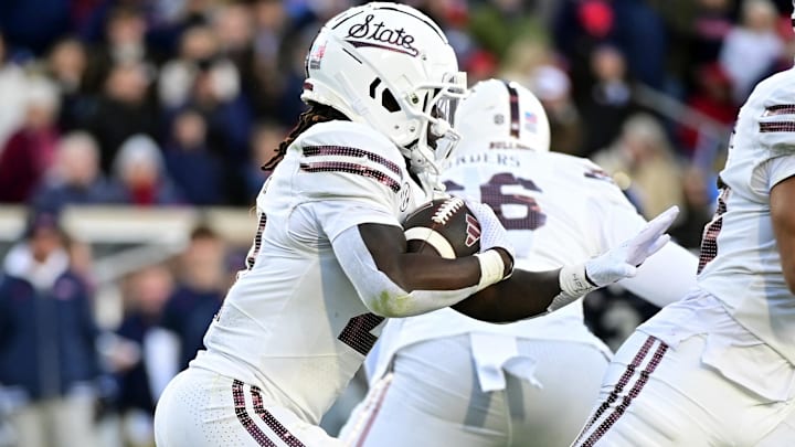 Nov 29, 2024; Oxford, Mississippi, USA; Mississippi State Bulldogs running back Davon Booth (21) runs the ball against the Mississippi Rebels during the second quarter at Vaught-Hemingway Stadium. Mandatory Credit: Matt Bush-Imagn Images