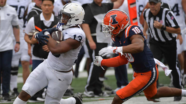 Penn State Nittany Lions running back Kaytron Allen (13) runs against Illinois Fighting Illini defensive lineman Mason Muragin (18)