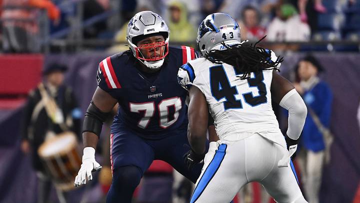 August 8, 2024; Foxborough, MA, USA; New England Patriots offensive tackle Caedan Wallace (70) lines up with Carolina Panthers linebacker Luiji Vilain (43) during the first half at Gillette Stadium. Mandatory Credit: Eric Canha-USA TODAY Sports August 8, 2024; Foxborough, MA, USA; New England Patriots offensive tackle Caedan Wallace (70) lines up with Carolina Panthers linebacker Luiji Vilain (43) during the first half at Gillette Stadium. Mandatory Credit: Eric Canha-USA TODAY Sports