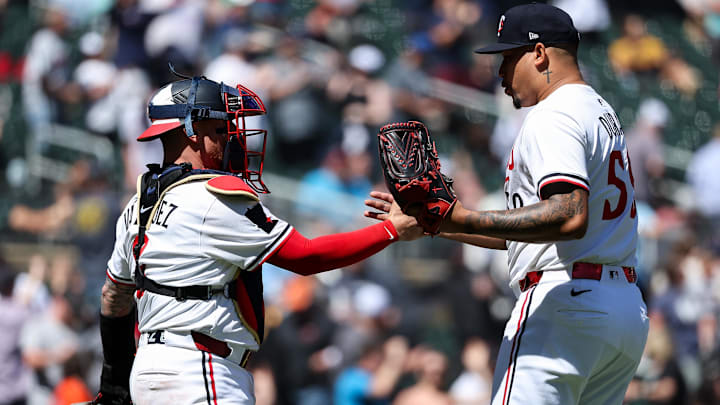 May 8, 2025; Minneapolis, Minnesota, USA; Minnesota Twins pitcher Jhoan Duran (59) and catcher Christian Vazquez (8) celebrate their teams win against the Baltimore Orioles after the game at Target Field.