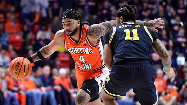 Feb 27, 2026; Champaign, Illinois, USA;  Illinois Fighting Illini guard Kylan Boswell (4) drives the ball against Michigan Wolverines guard Roddy Gayle Jr. (11) during the first half at State Farm Center. Mandatory Credit: Ron Johnson-Imagn Images