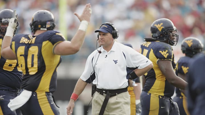 Jan 01, 2005; Jacksonville, FL, USA;  West Virginia Mountaineers head coach Rich Rodriguez walks the sidelines after West Virginia was successful on a third-quarter field goal attempt in the 2005 Toyota Gator Bowl held at Alltel Stadium. Mandatory Credit: Photo by Imagn Images (©) Copyright 2004 by Preston Mack