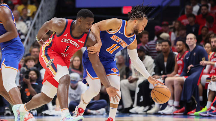 New Orleans Pelicans forward Zion Williamson (1) attempts to steal the ball from New York Knicks guard Jalen Brunson (11) in the third quarter at Smoothie King Center. Mandatory Credit: Matthew Dobbins-Imagn Images