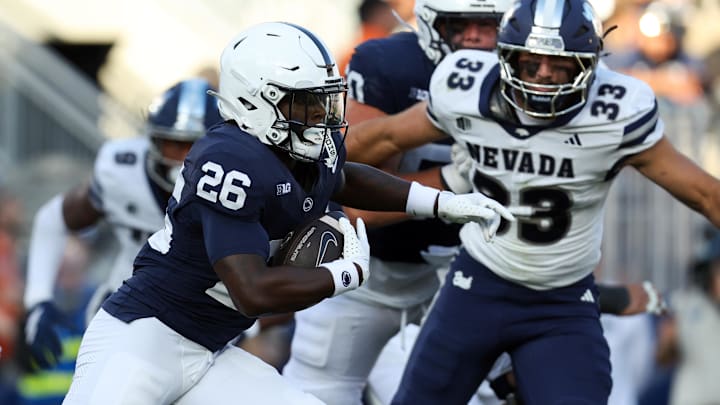 Penn State Nittany Lions running back Cam Wallace (26) runs with the ball during the fourth quarter against the Nevada Wolf Pack at Beaver Stadium. Penn State Nittany Lions running back Cam Wallace (26) runs with the ball during the fourth quarter against the Nevada Wolf Pack at Beaver Stadium.