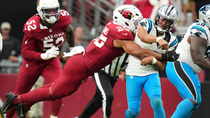 Arizona Cardinals linebacker Zaven Collins (25) hits Carolina Panthers quarterback Bryce Young (9)at State Farm Stadium on Sept 14, 2025.