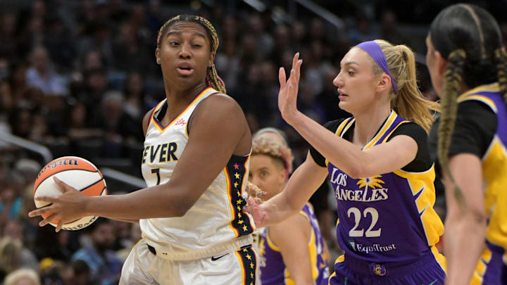 May 24, 2024; Los Angeles, California, USA;   Indiana Fever forward Aliyah Boston (7) is defended by Los Angeles Sparks forward Cameron Brink (22) in the first half at Crypto.com Arena. Mandatory Credit: Jayne Kamin-Oncea-Imagn Images