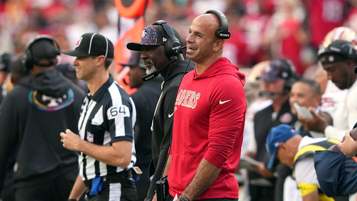 San Francisco 49ers defensive coordinator Robert Saleh (in red).