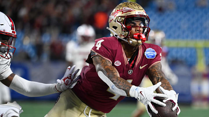 Dec 2, 2023; Charlotte, NC, USA; Florida State Seminoles wide receiver Keon Coleman (4) makes a