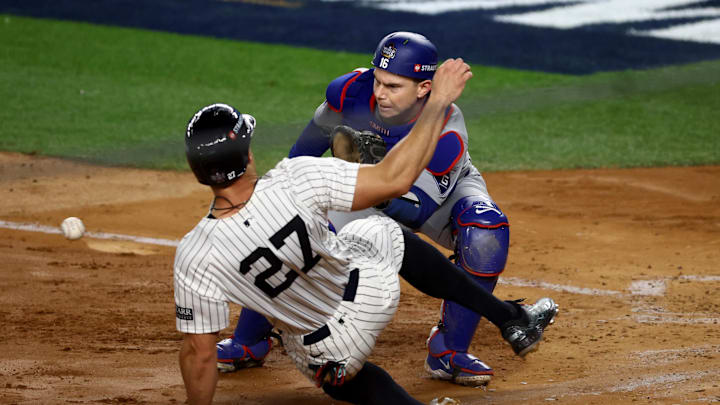 Giancarlo Stanton slides into home plate against the Dodgers in Game 3. 