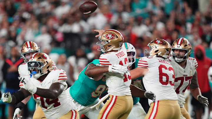 Dec 22, 2024; Miami Gardens, Florida, USA; Miami Dolphins defensive tackle Calais Campbell (93) hits San Francisco 49ers quarterback Brock Purdy (13) on the pass attempt during second half at Hard Rock Stadium. Mandatory Credit: Jasen Vinlove-Imagn Images