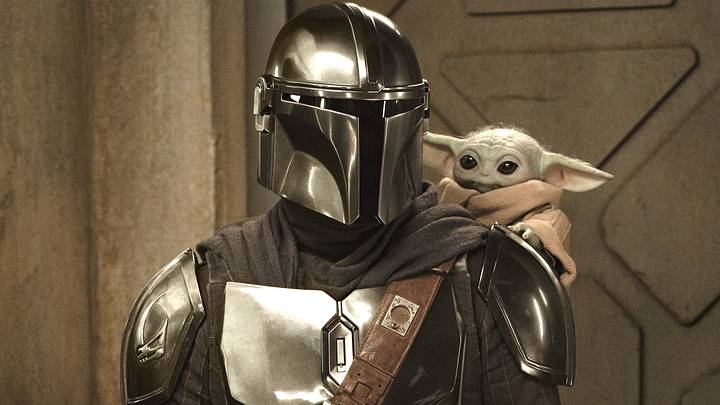 (L-R) The Mandalorian and Grogu in Lucasfilm's THE MANDALORIAN AND GROGU (L-R) The Mandalorian and Grogu in Lucasfilm's THE MANDALORIAN AND GROGU