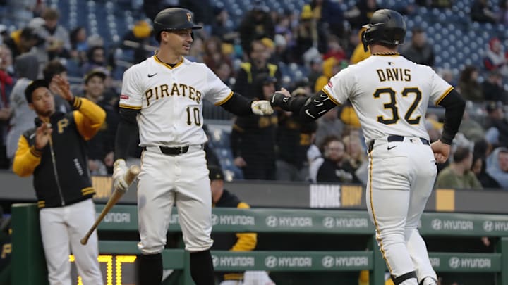 Apr 16, 2025; Pittsburgh, Pennsylvania, USA;  Pittsburgh Pirates designated hitter Bryan Reynolds (10) congratulates catcher Henry Davis (32) on his solo home run against the Washington Nationals during the fifth inning at PNC Park. Mandatory Credit: Charles LeClaire-Imagn Images