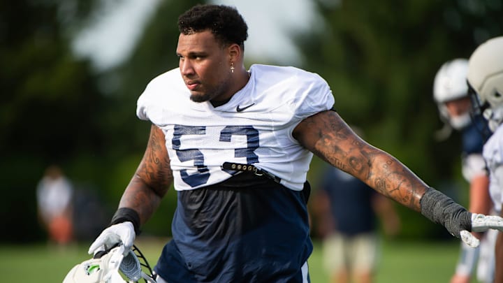 Penn State offensive lineman Nick Dawkins drops a towel while practicing outside Holuba Hall on Saturday, August 2, 2025, in State College.