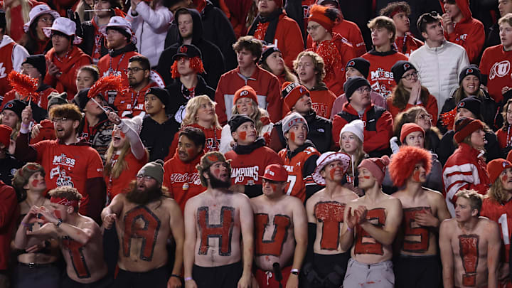 Utah Utes students cheer for their team against the Brigham Young Cougars.