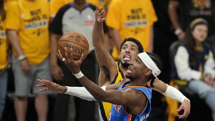 Oklahoma City Thunder guard Gilgeous-Alexander shoots the ball against Indiana Pacers guard Haliburton during the first half during the 2025 NBA Finals at Gainbridge Fieldhouse. 