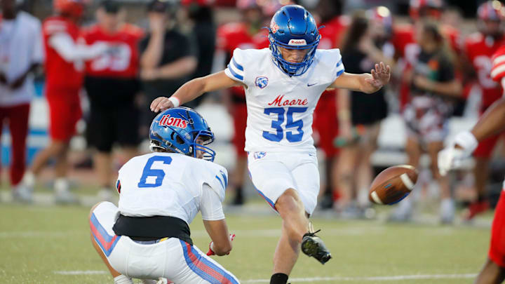 Moore's Liam Evans (35) kicks a field goal during a high school football game between Moore and Westmoore