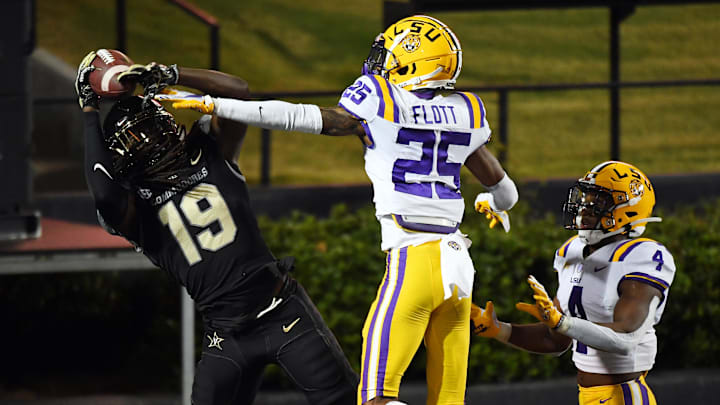 Oct 3, 2020; Nashville, Tennessee, USA; LSU Tigers cornerback Cordale Flott (25) tips a pass causing Vanderbilt Commodores wide receiver Chris Pierce (19) to drop it in the end zone during the second half at Vanderbilt Stadium. Oct 3, 2020; Nashville, Tennessee, USA; LSU Tigers cornerback Cordale Flott (25) tips a pass causing Vanderbilt Commodores wide receiver Chris Pierce (19) to drop it in the end zone during the second half at Vanderbilt Stadium.